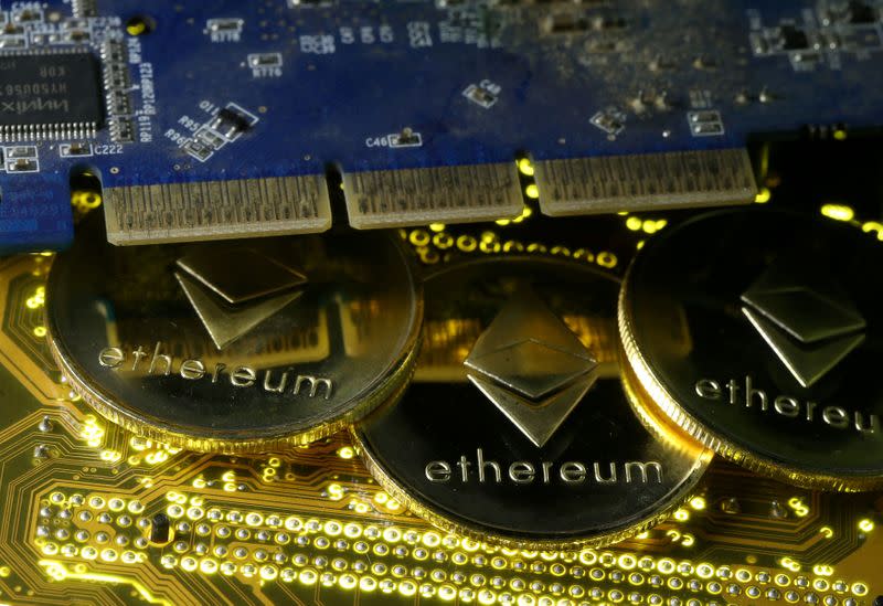 FILE PHOTO: Representations of the Ethereum virtual currency standing on the PC motherboard are seen in this illustration picture