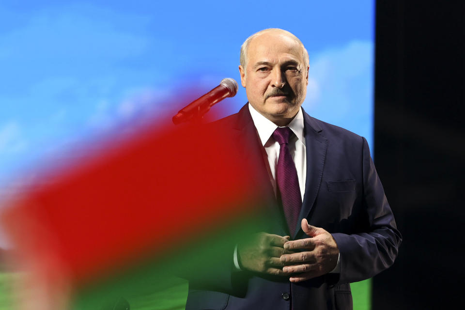 Belarusian President Alexander Lukashenko addresses a women's forum in Minsk, Belarus, Thursday, Sept. 17, 2020. Lukashenko has given a speech at a women's forum with some good quotes—he's announced Belarus will close the border with Ukraine, Poland and Lithuania, and is mobilizing half the army. (BelTA Pool Photo via AP)