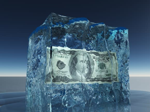 A $100 bill encased in a block of ice