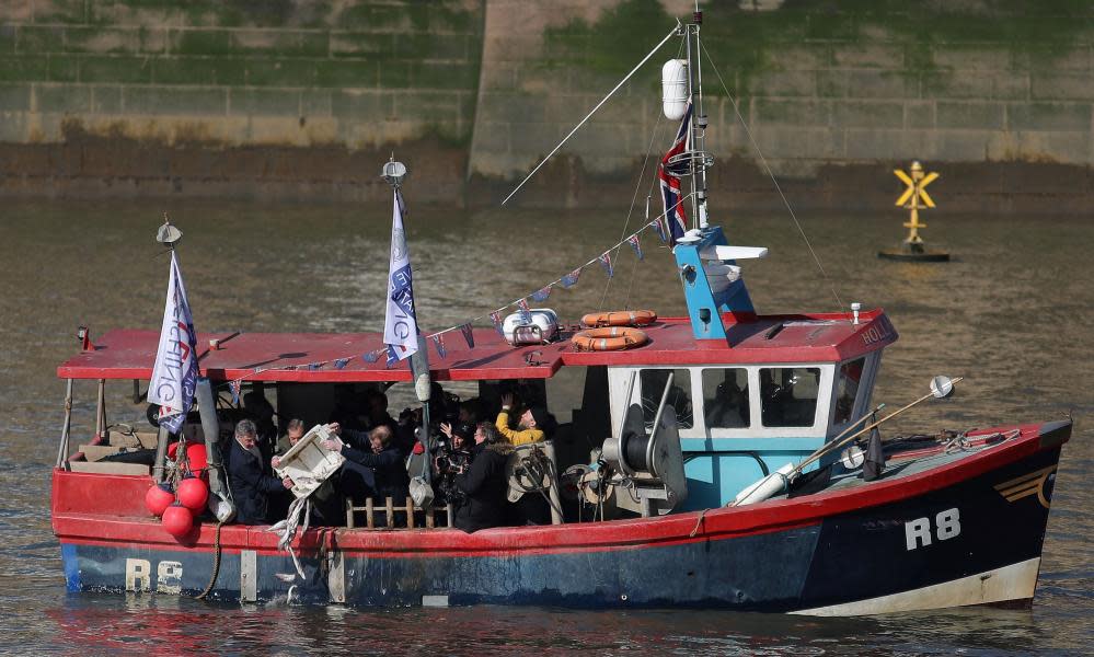 Former UK Independence Party (UKIP) Leader Nigel Farage (2L), to throw fish into the River Thames