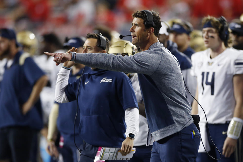 Akron head coach Tom Arth instructs his team against Ohio State during the second half of an NCAA college football game Saturday, Sept. 25, 2021, in Columbus, Ohio. (AP Photo/Jay LaPrete)