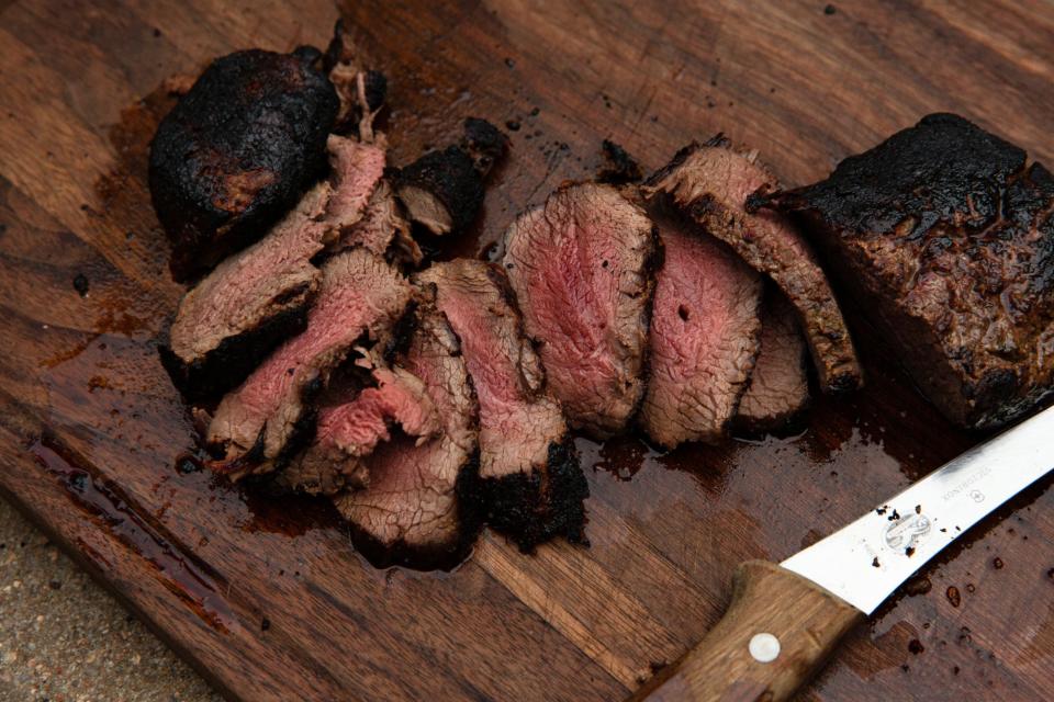 sliced venison on cutting board