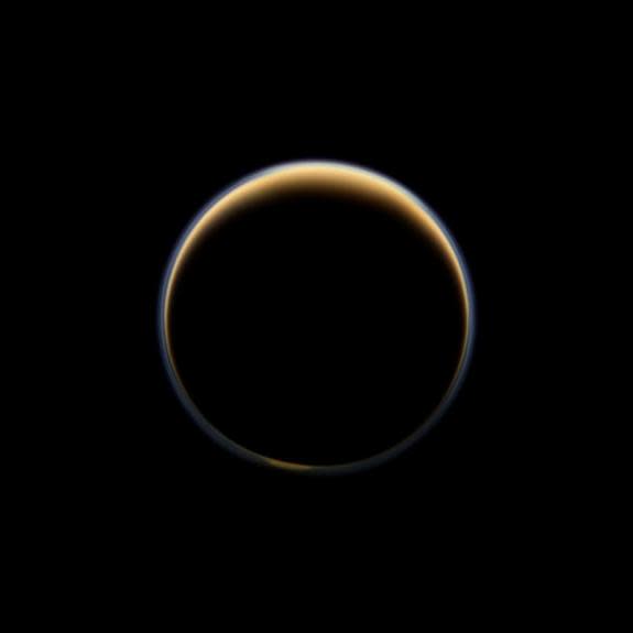 This night-side photo of Titan taken by the Cassini spacecraft shows a buildup of haze over the Saturn moon's south pole (bottom). Cassini has found a build up of haze over the south pole (bottom). New results from Cassini's infrared spectromet