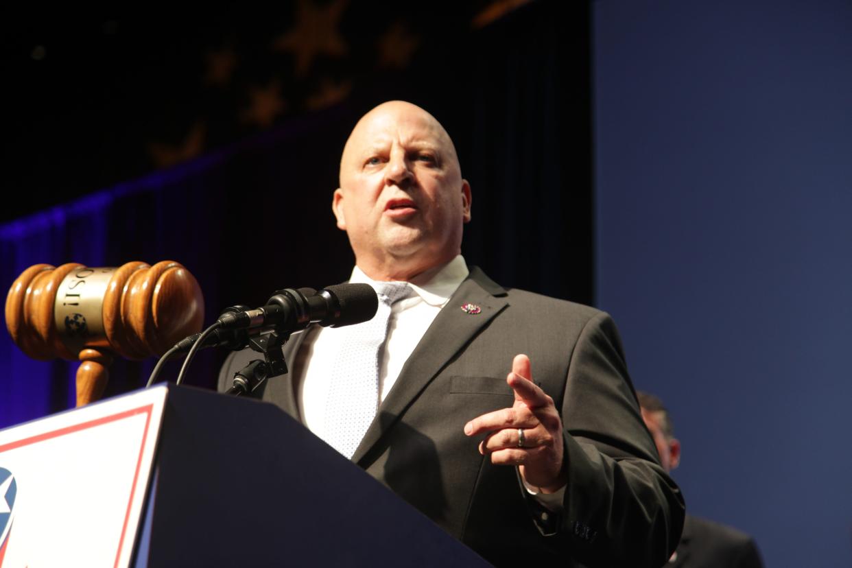 Tennessee U.S. Rep. Scott Desjarlais holds a gavel with the term "Fire Pelosi" imprinted on it at the 44th annual Statesmen's Dinner hosted by the Tennessee Republican Party on July 31, 2021.