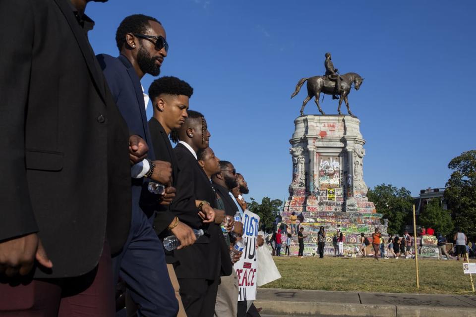 <div class="inline-image__caption"><p>Black Lives Matter activists occupy the traffic circle underneath the statue of Confederate Gen. Robert Lee in Richmond, Virginia.</p></div> <div class="inline-image__credit">Andrew Lichtenstein/Corbis via Getty</div>