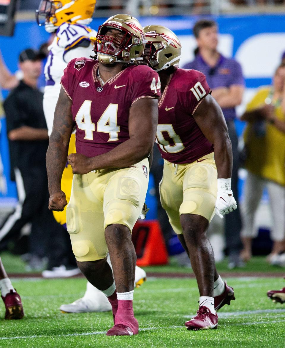 Florida State Seminoles defensive lineman Joshua Farmer (44) celebrates a sack during a game against the LSU Tigers on Sunday, Sept. 3, 2023.