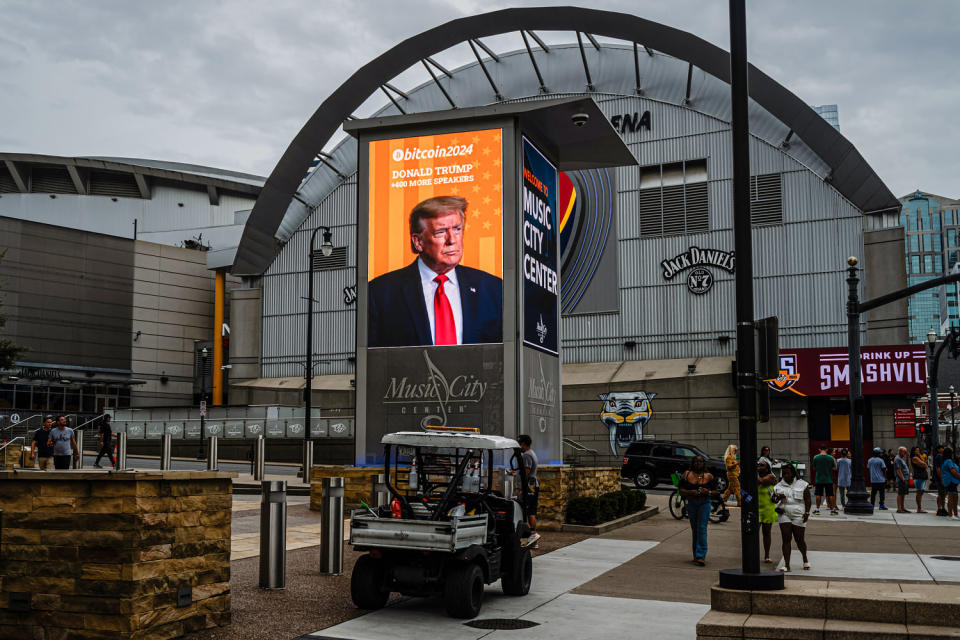 Photograph of Donald Trump on a digital display outside the venue.  (Jon Cherry/Getty Images)