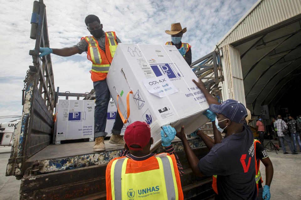 FILE - In this March 15, 2021, file photo, boxes of AstraZeneca COVID-19 vaccine manufactured by the Serum Institute of India and provided through the global COVAX initiative arrive at the airport in Mogadishu, Somalia. The world's largest vaccine maker, based in India, will be able to restart exports of AstraZeneca doses by June if new coronavirus infections subside in the country, its chief executive said Tuesday, April 6. On March 25, COVAX announced a major setback in its vaccine rollout because a surge in infections in India had caused the Serum Institute of India to cater to domestic demand, resulting in a delay in global shipments of up to 90 million doses. (AP Photo/Farah Abdi Warsameh, File)