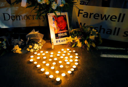 Candles are formed in the shape of a heart during a vigil for Chinese Nobel Peace Prize laureate Liu Xiaobo outside China's consulate in Sydney, Australia July 14, 2017. REUTERS/Jason Reed