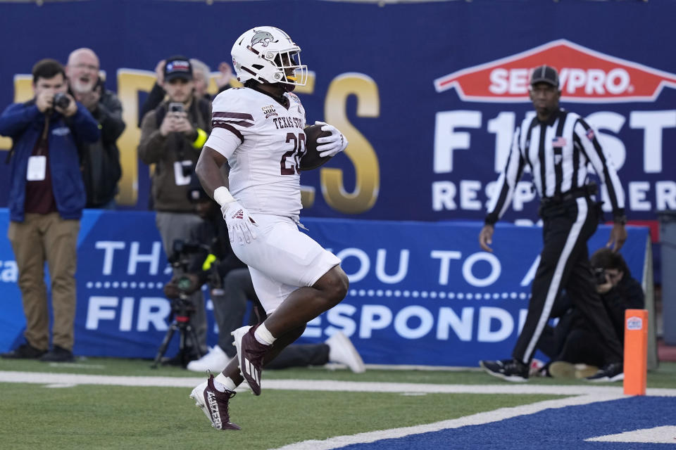 Texas State running back Jahmyl Jeter runs for a touchdown against Rice during the first half of the First Responder Bowl NCAA college football game Tuesday, Dec. 26, 2023, in Dallas. (AP Photo/LM Otero)