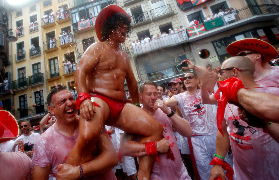 <p>Revellers play and celebrate during the opening of the San Fermin festival in Pamplona, Spain, July 6, 2018. (Photo: Joseba Etxaburu/Reuters) </p>