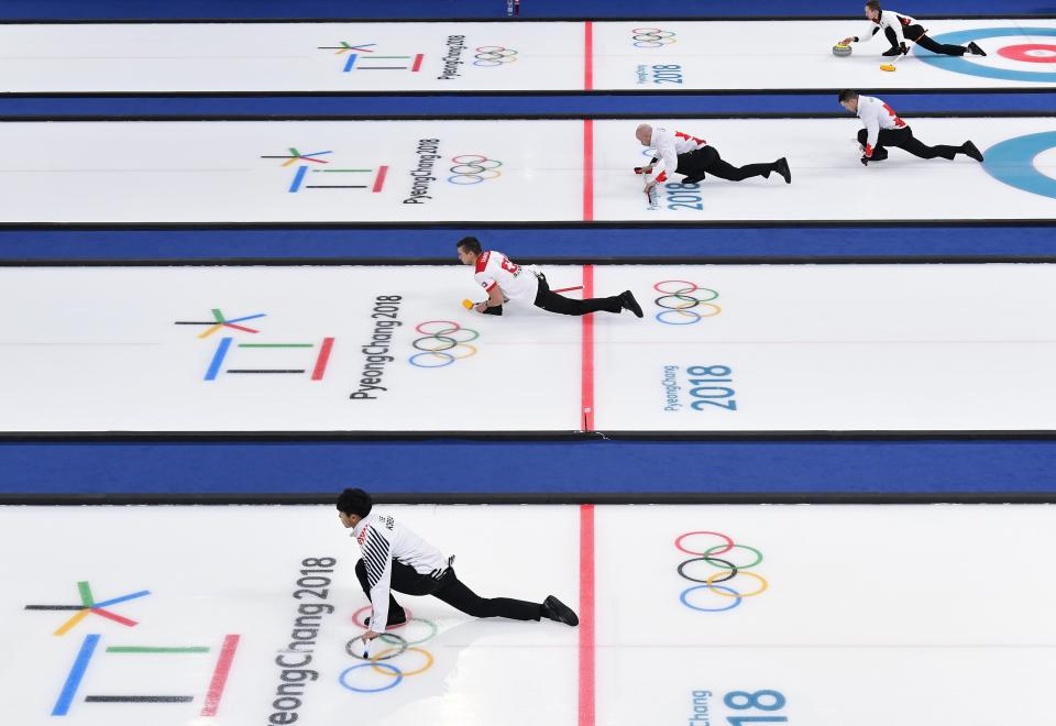 <p>Curlers practice and warm up on curling sheets ahead of session 9 of the Men’s Round Robin. REUTERS/Toby Melville </p>