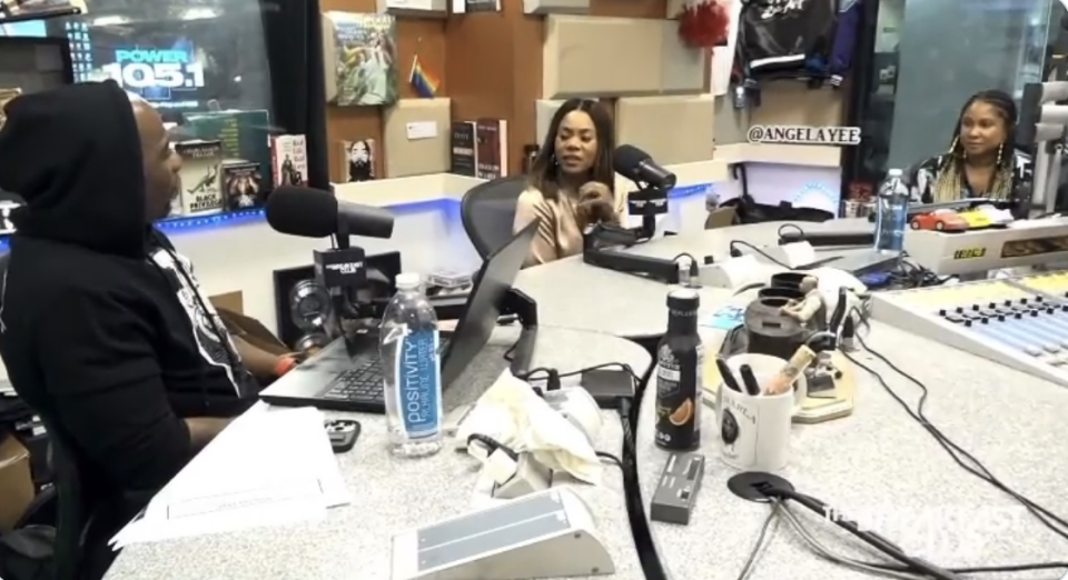 Regina in the studio with the Breakfast Club