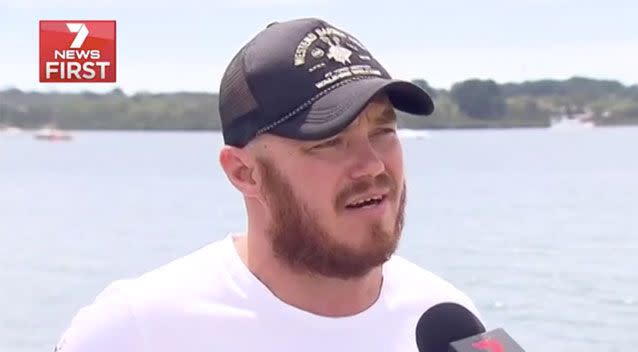 Brett Palmer has told of how he was flung from his kayak by a shark on Saturday night. Source: 7 News