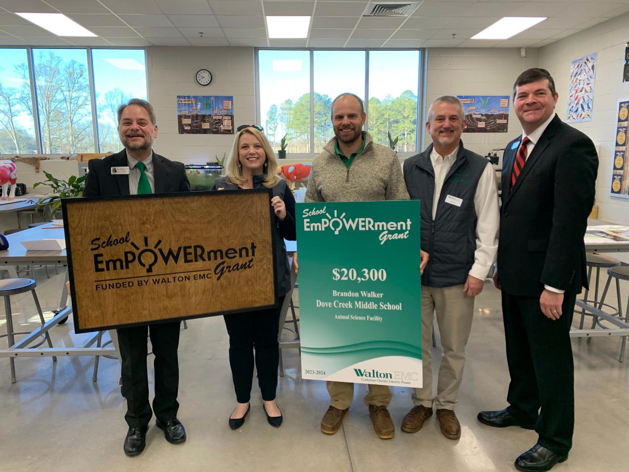 Eighteen educators at 11 Oconee schools received more than $78,000 in grant funding from Walton EMC in early February 2024. Pictured are Dr. Mike Eddy, Dove Creek Middle School; Jennifer Broun, Walton EMC; Brandon Walker, Dove Creek Middle; Jeff Paul, Walton EMC; and, Dr. Jason Branch, Oconee County schools superintendent.