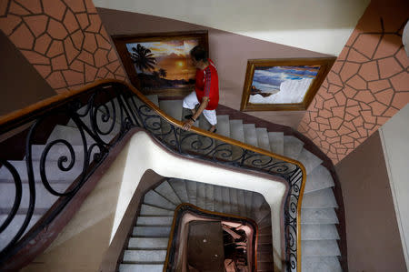 Hisham Abu al-Ela, a 55-year-old businessman, climbs the stairs at his house which hasn't been demolished yet, in the so-called "Maspero Triangle", in Cairo, Egypt, September 13, 2018. REUTERS/Amr Abdallah Dalsh