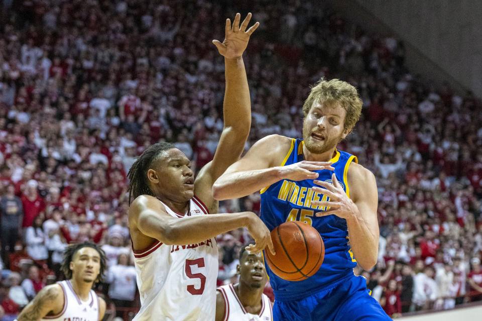 Indiana forward Malik Reneau (5) knocks the ball away from Morehead State forward Alex Gross (45) during the first half of an NCAA college basketball game, Monday, Nov. 7, 2022, in Bloomington, Ind. (AP Photo/Doug McSchooler)