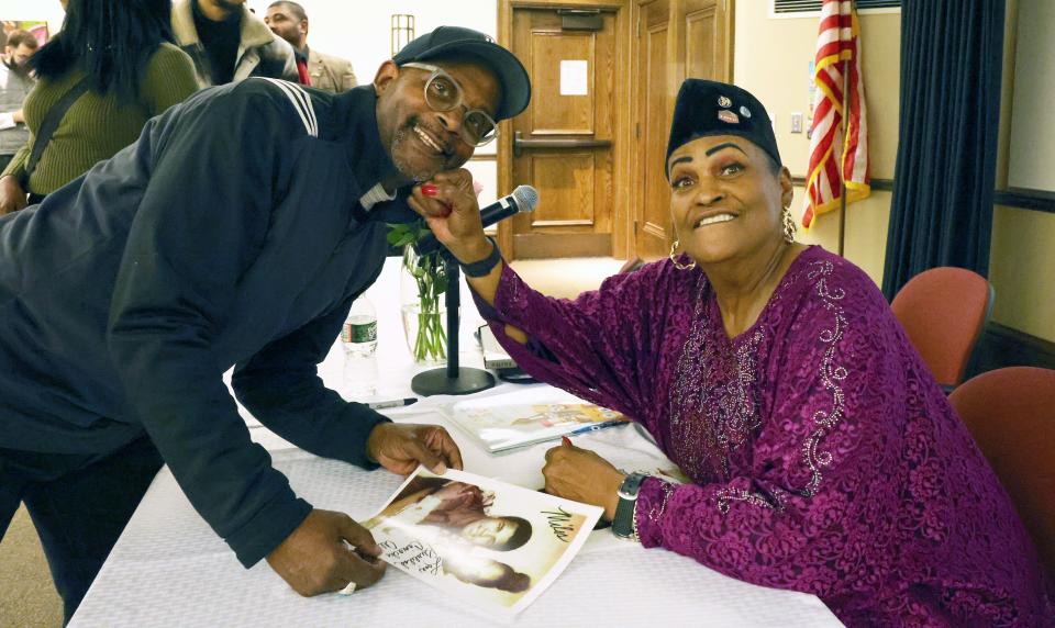 Miles Jackson with Khalilah Camacho-Ali, Muhammad Ali's ex-wife, who visited the Brockton Public Library on Saturday, March 4, 2023.