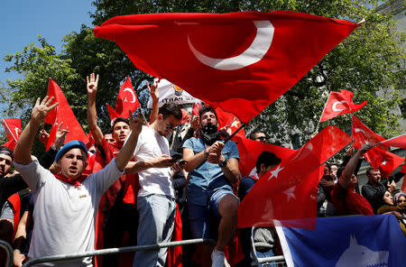 Demonstrators wave flags outside Downing Street ahead of the visit by Turkey's President Recep Tayyip Erdogan, in London, Britain, May 15, 2018. REUTERS/Phil Noble