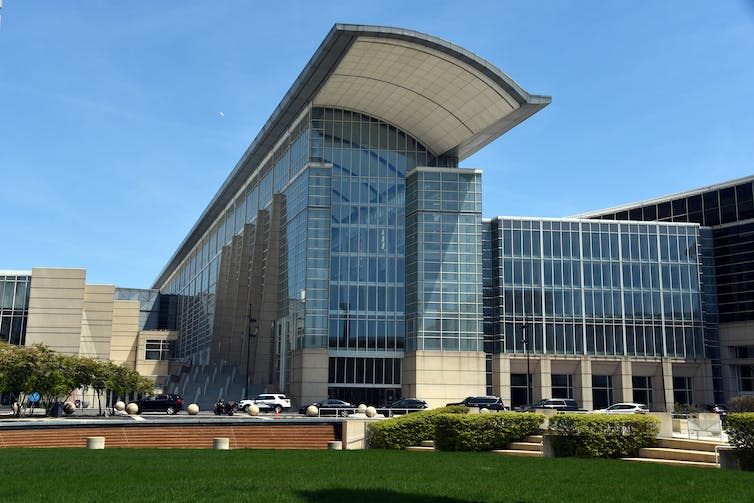 A convention centre with sheer glass walls.