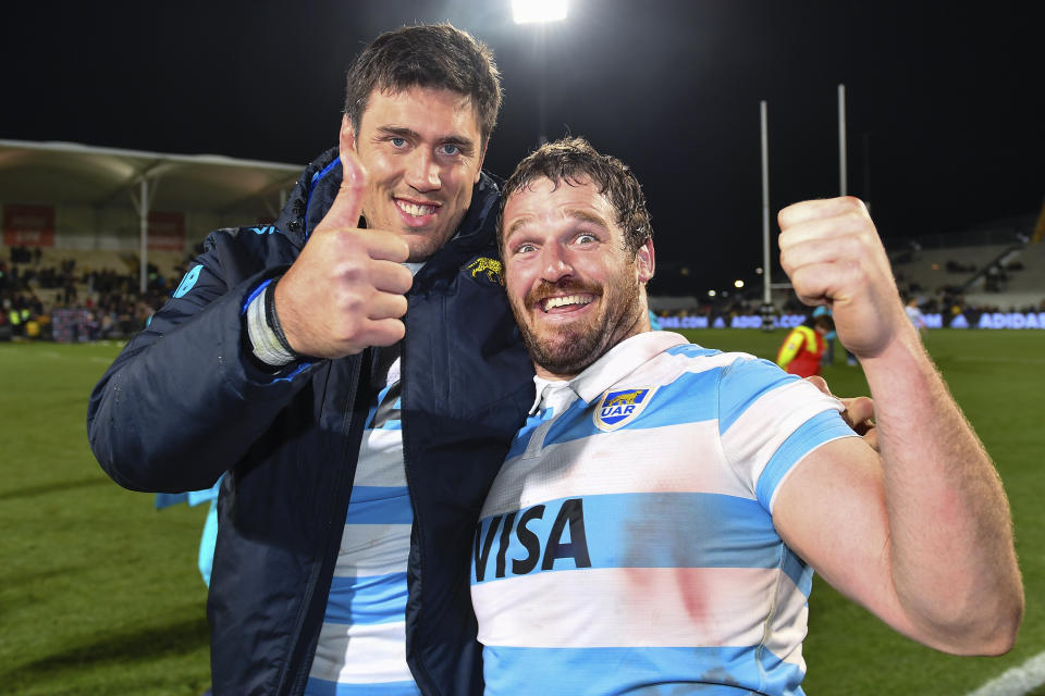 Argentina's Matias Alemanno, left, and Julian Montoya celebrate their Rugby Championship test match victory of New Zealand in Christchurch, New Zealand, Saturday, Aug. 27, 2022. (John Davidson/Photosport via AP)