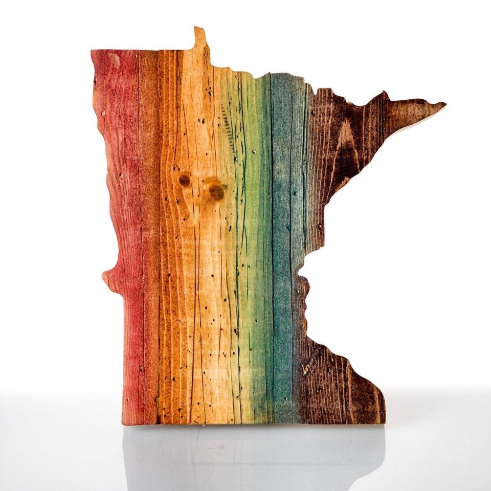 One of Hagen and Oats "stainbow" wood pieces, carved in the shape of the state of Minnesota.