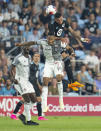 Minnesota United midfielder Kervin Arriaga (33) heads the ball over Toronto FC midfielder Mark-Anthony Kaye (14) during the second half of an MLS soccer match Saturday, June 3, 2023, in St. Paul, Minn. (Alex Kormann/Star Tribune via AP)