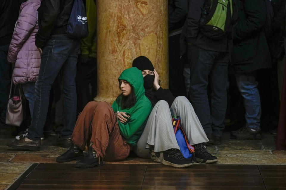 People visit the Church of the Nativity, traditionally believed to be the birthplace of Jesus Christ, in the West Bank town of Bethlehem, Saturday , Dec. 24, 2022. (AP Photo/Majdi Mohammed)