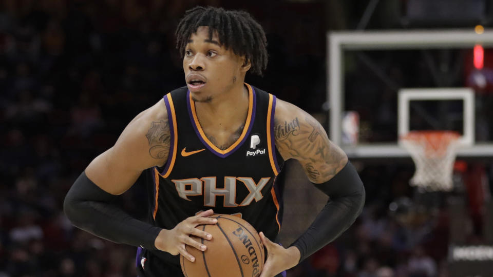 Phoenix Suns' Richaun Holmes looks to pass against the Cleveland Cavaliers in the second half of an NBA basketball game, Thursday, Feb. 21, 2019, in Cleveland. (AP Photo/Tony Dejak)