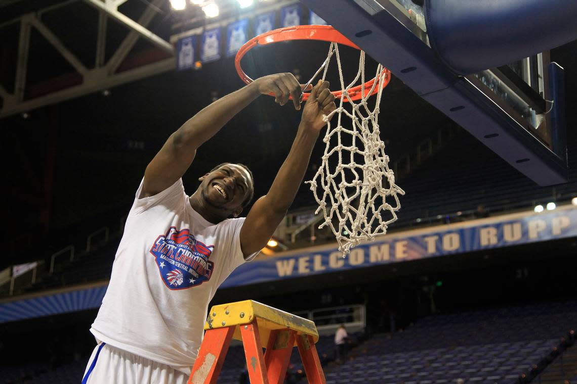 Dominique Hawkins snipped a piece of the net after Madison Central won the 2013 Sweet Sixteen state tournament with a 65-64 win over Ballard.