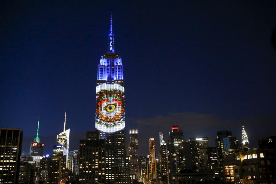 Images are projected onto the Empire State Building as part of an endangered species projection to raise awareness, in New York August 1, 2015. (REUTERS/Eduardo Munoz)