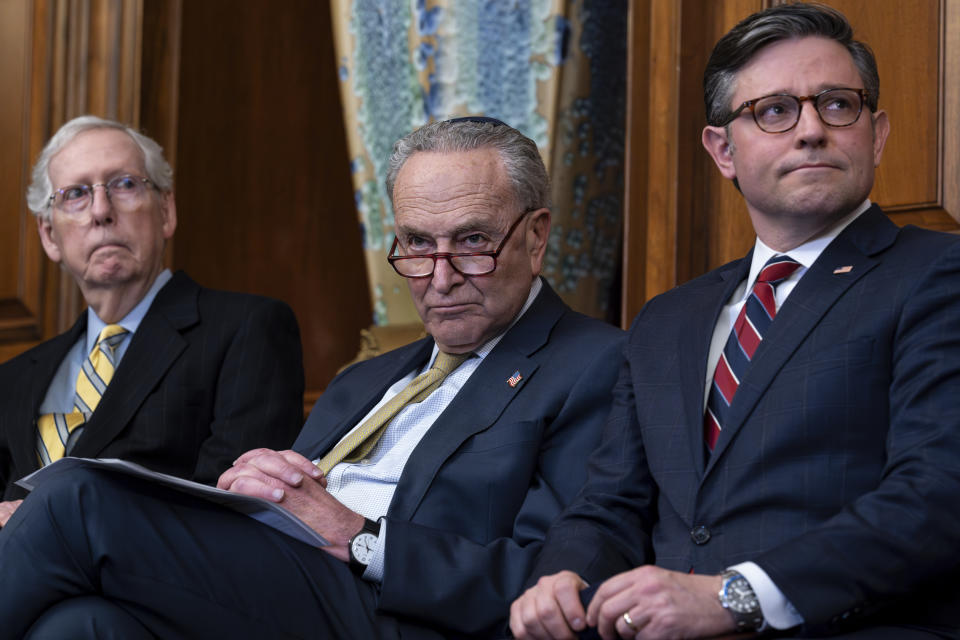 From left, Senate Minority Leader Mitch McConnell (R-Ky.), Senate Majority Leader Chuck Schumer (D-N.Y.), and House Speaker Mike Johnson (R-La.) at the Capitol on Dec. 12, 2023. (J. Scott Applewhite/AP)