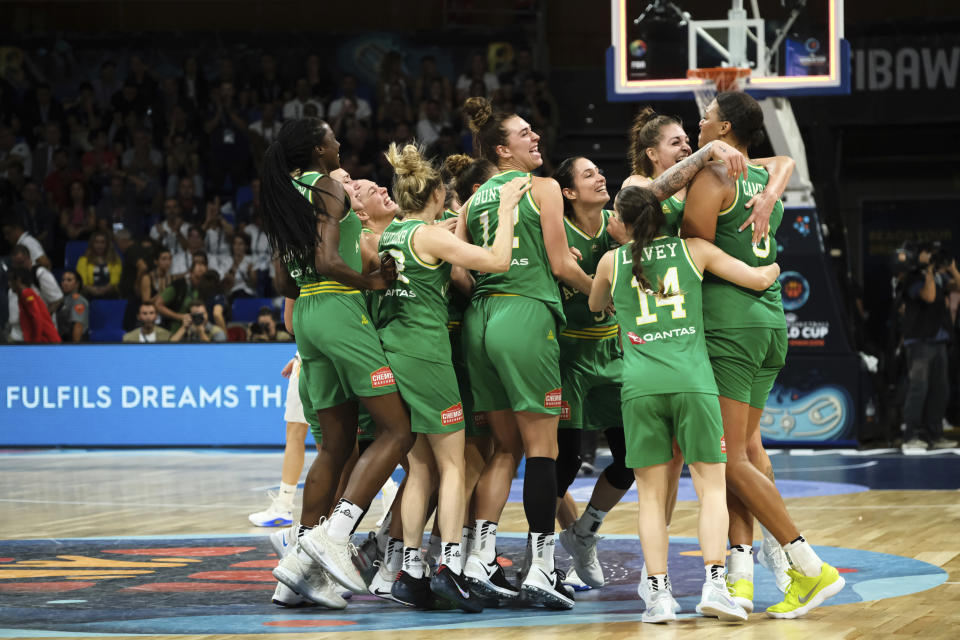 The Australian team celebrate their victory over Spain in the Women's basketball World Cup semi final match between Spain and Australia in Tenerife, Spain, Saturday Sept. 29, 2018. (AP Photo Andres Gutierrez)