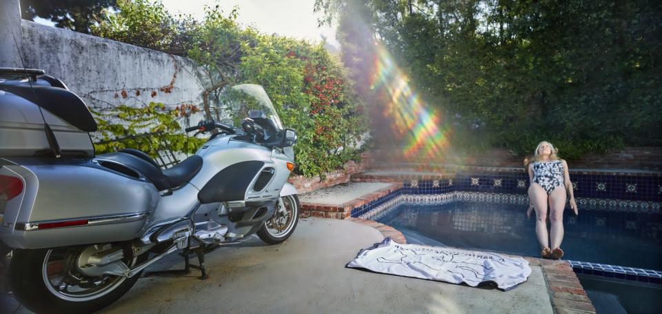 Author and screenwriter Tinker Lindsay is photographed by Jim Krantz falling backward into her pool in Beachwood Canyon.