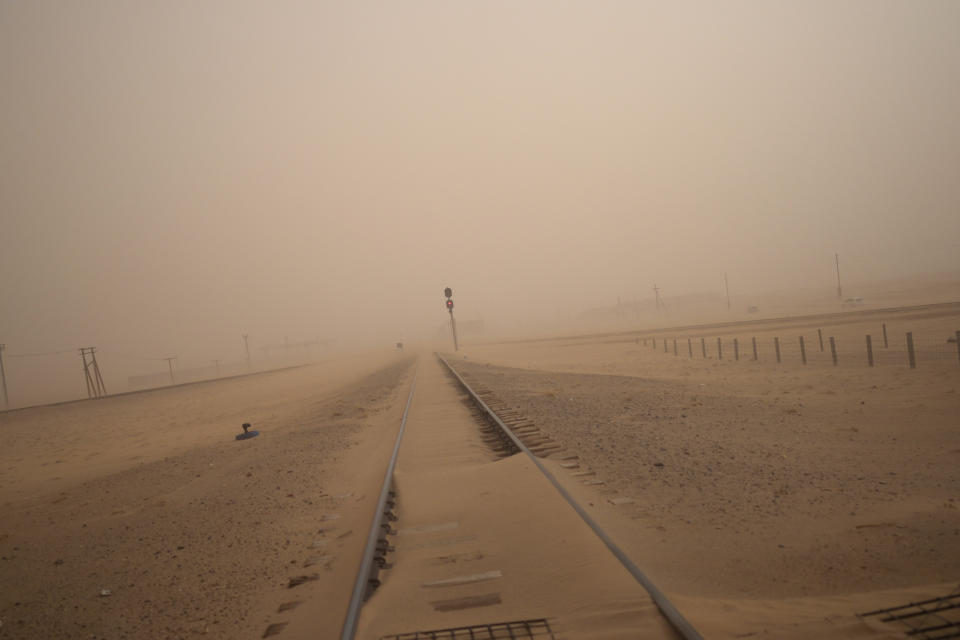 A sandstorm covers a railway track in Sainshand, east of Gobi desert, in Mongolia, May 19, 2023. (AP Photo/Manish Swarup)