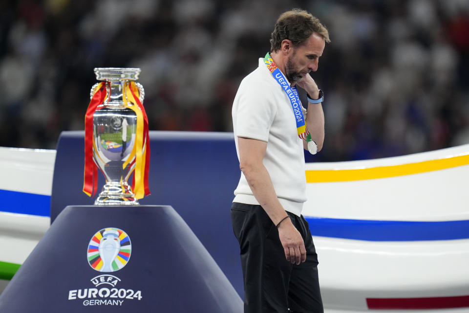 England's manager Gareth Southgate walks past the trophy at the end of the final match between Spain and England at the Euro 2024 soccer tournament in Berlin, Germany, Sunday, July 14, 2024. Spain won 2-1. (AP Photo/Manu Fernandez)