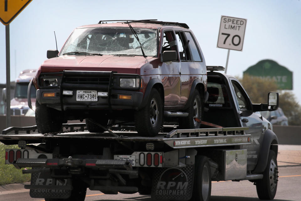 <p>The vehicle that the Austin package bomber, Mark Anthony Conditt, was driving when he blew himself up is towed from the crime scene along Interstate 35 in suburban Austin on March 21, 2018 in Round Rock, Texas. (Photo: Scott Olson/Getty Images) </p>