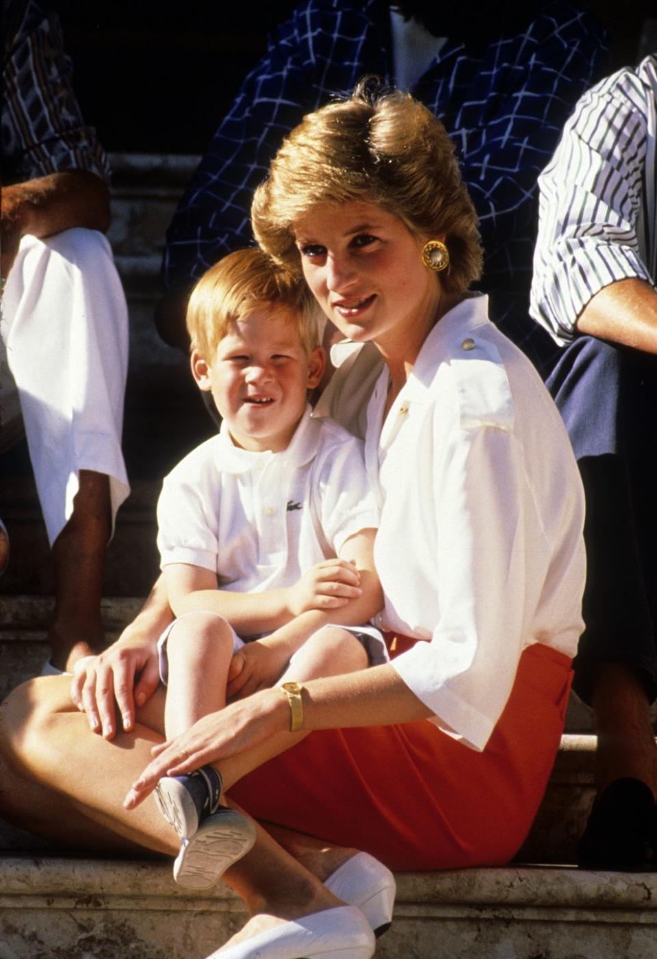 palma, majorca august 13 prince harry sits on the lap of his mother, diana, princess of wales, whilst on holiday in majorca on august 13, 1988 in palma, majorca photo by anwar husseingetty images