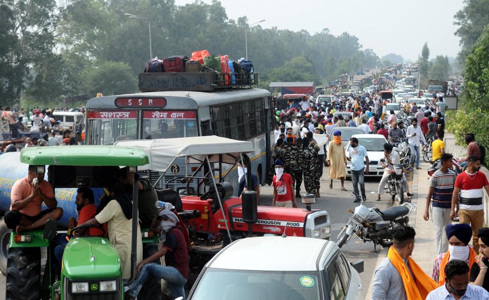 Farmers arrive to protest against the Electricity Amendment Bill 2020 and agriculture reforms bills passed in the Parliament, at NH-7 Delhi-Amritsar Highway, at Shambhu Border, on September 25, 2020 in Patiala, India. The two bills - the Farmers (Empowerment and Protection) Agreement on Price Assurance and Farm Services Bill, 2020 and the Farming Produce Trade and Commerce (Promotion and Facilitation) Bill, 2020 - were passed by the Rajya Sabha despite uproar and strong protest by the Opposition parties in the house. (Photo by Bharat Bhushan/Hindustan Times via Getty Images)