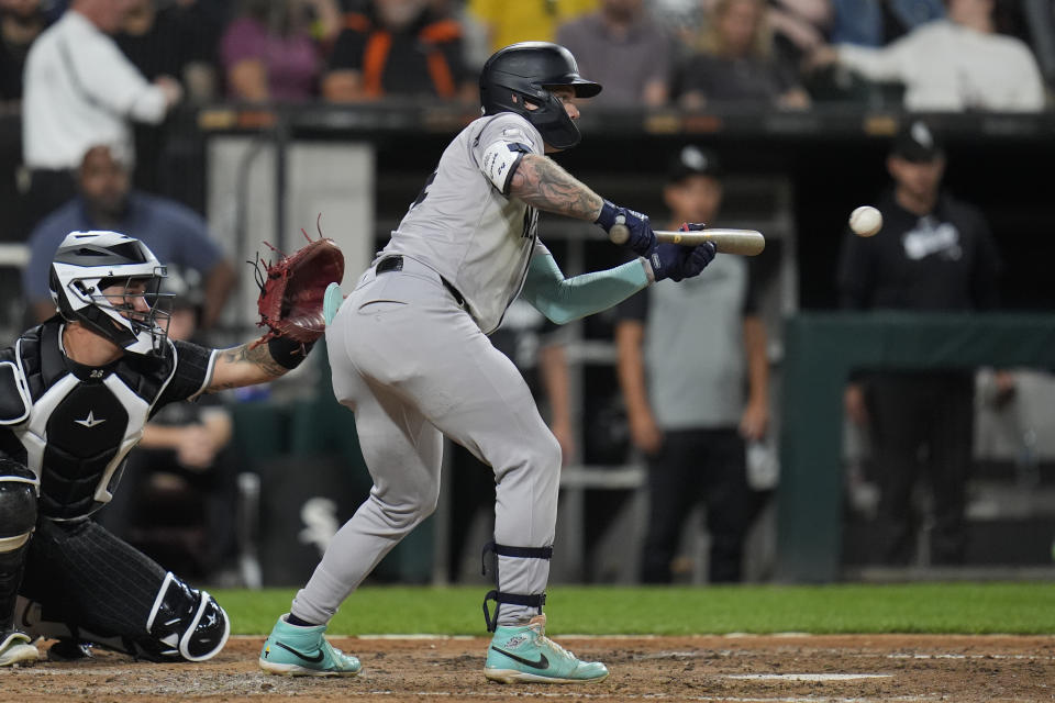 New York Yankees' Alex Verdugo bunts a popout to Chicago White Sox's starting pitcher Ky Bush during the fourth inning of a baseball game Monday, Aug. 12, 2024, in Chicago. (AP Photo/Erin Hooley)