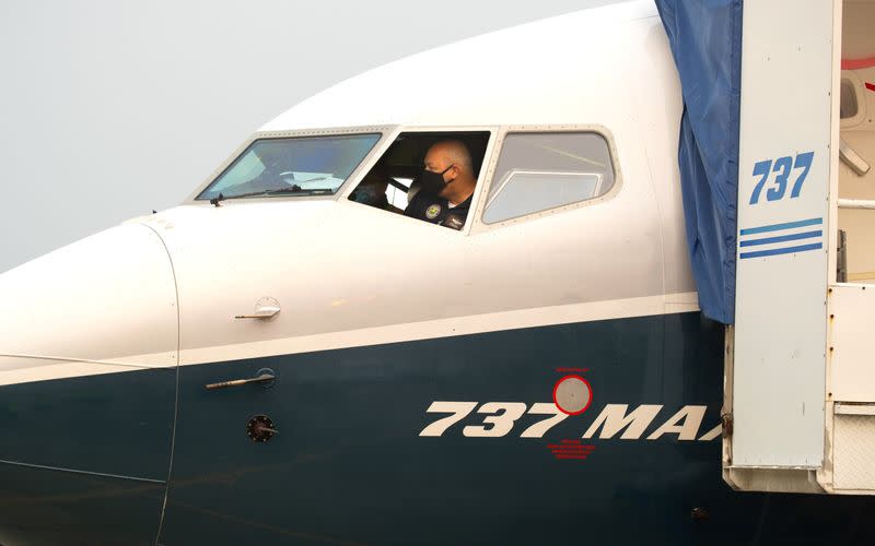 FAA Chief Steve Dickson conducts a pre-flight check in a Boeing 737 MAX aircraft in Seattle