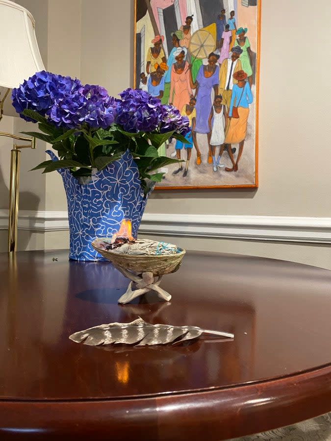 Director of the White House Domestic Policy Council Susan Rice, burns sage in her office, which was formerly occupied by Donald Trump strategist Stephen Miller.  (Susan Rice via Twitter)