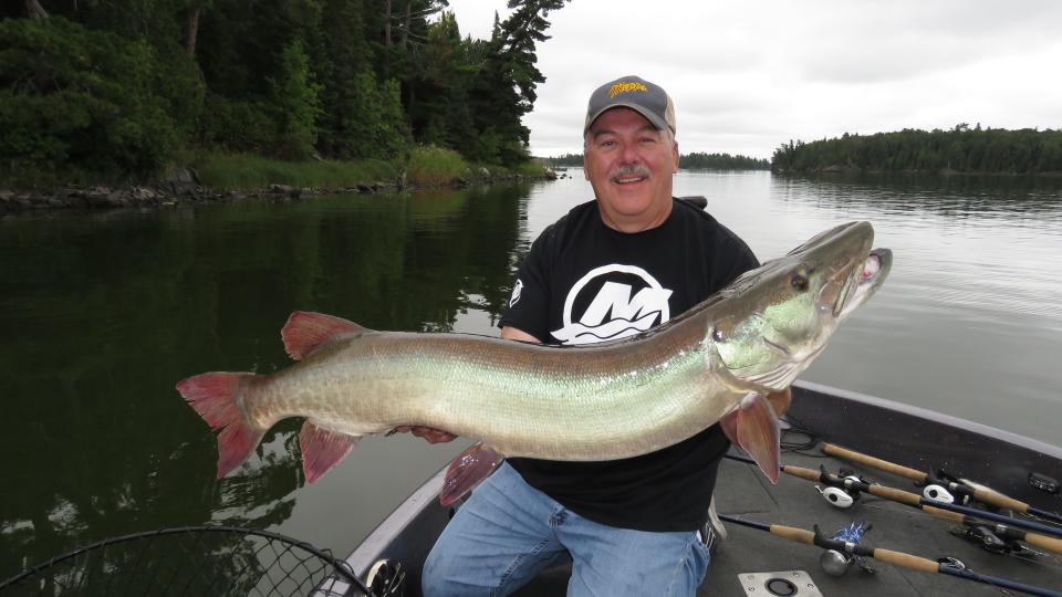 Steve Heiting of Minocqua holds a muskellunge, the Wisconsin state fish.