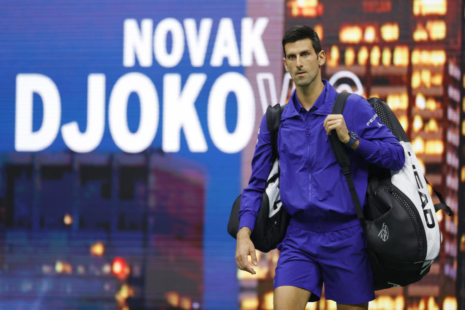 Novak Djokovic (pictured) walks out onto the court to warm-up against Holger Rune at the US Open.