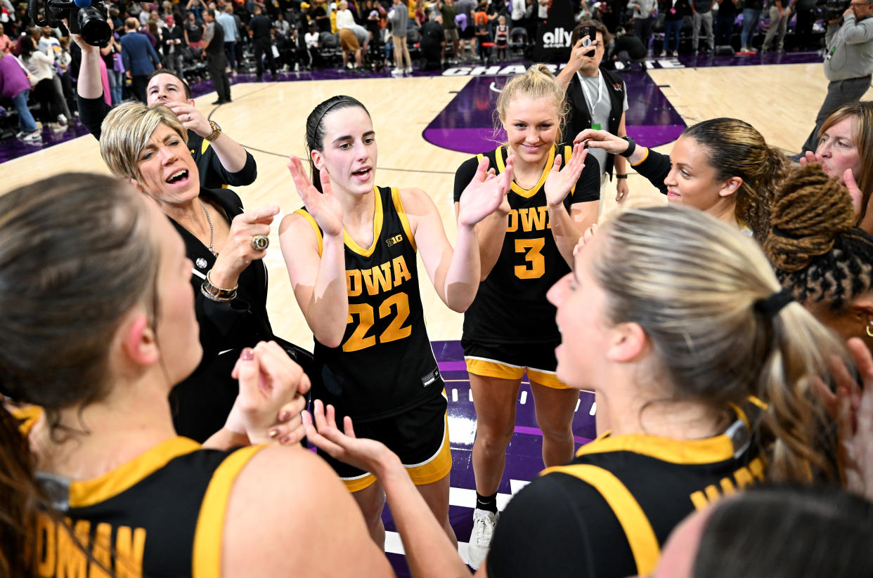 Caitlin Clark celebrates with her Iowa teammates after a 80-76 victory over Virginia Tech at Spectrum Center in Charlotte, North Carolina, on Nov. 9, 2023. (Photo by G Fiume/Getty Images)