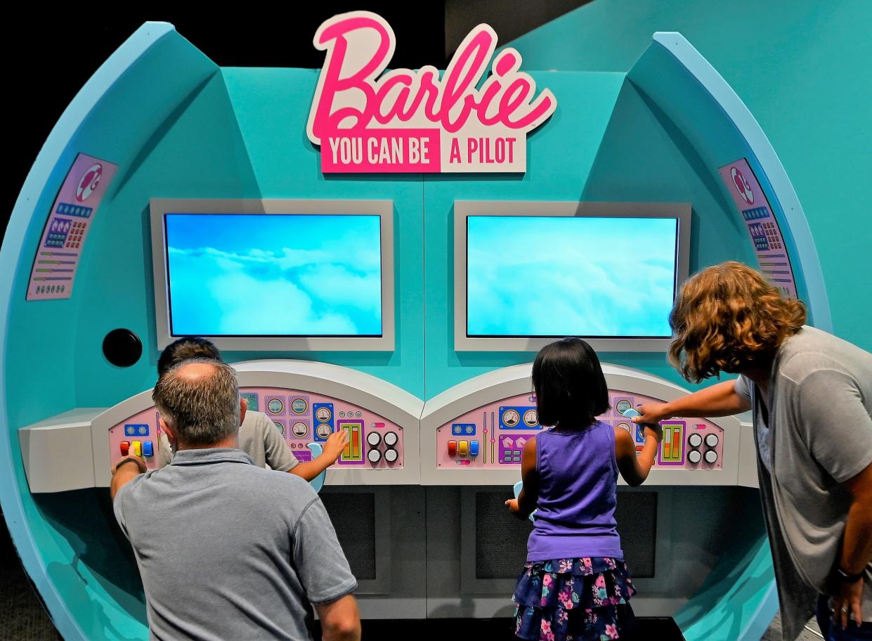 The interactive "Barbie You Can Be Anything: The Experience" exhibit, which will open at COSI on Oct. 4, allows youngsters to try their hands at career experiences like being a pilot.