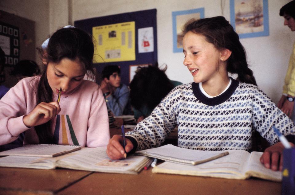 Classroom of a rural school Two girls study and converse in the classroom of a rural school  (Photo by JMN/Cover/Getty Images)