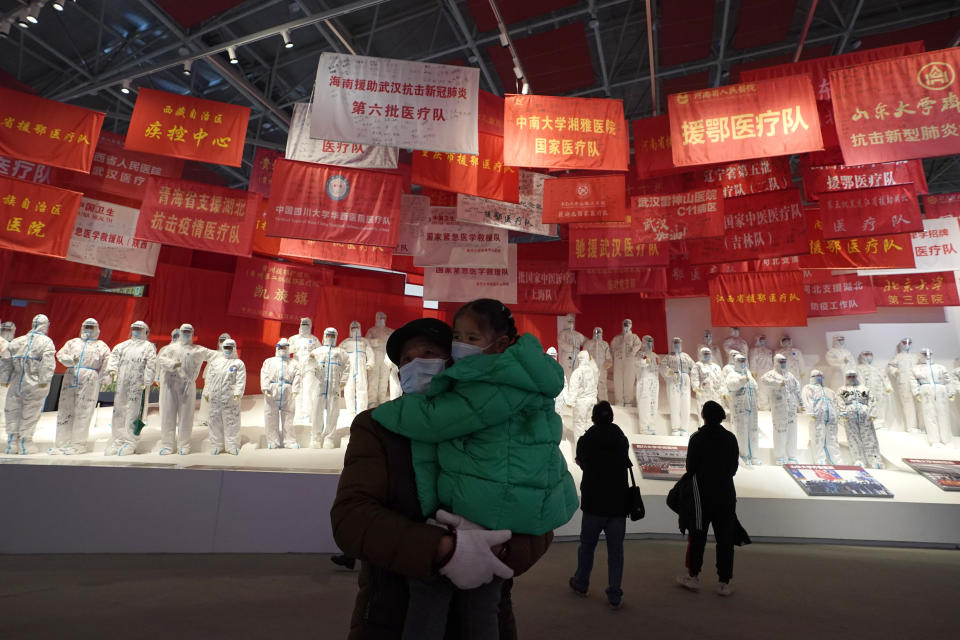 Residents attend an exhibition on the city's fight against the coronavirus in Wuhan in central China's Hubei province, Saturday, Jan. 23, 2021. A year after it was locked down to contain the spread of coronavirus, the central Chinese city of Wuhan has largely returned to normal, even as China continues to battle outbreaks elsewhere in the country. (AP Photo/Ng Han Guan)