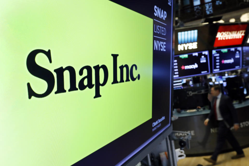 FILE - The logo for Snap Inc. appears above a post on the floor of the New York Stock Exchange, Feb. 5, 2020. Social media companies are having a tough go of it so far in 2022 as Snap issued a profit warning due to current economic conditions. Snap Inc., the parent of Snapchat, disclosed in a regulatory filing on Monday, May 23, 2022 that ever since it provided its outlook for the second quarter last month, “the macroeconomic environment has deteriorated further and faster than anticipated.” (AP Photo/Richard Drew, file)