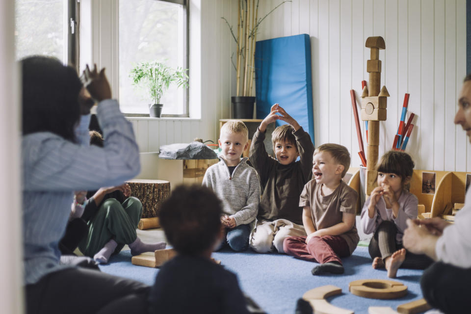 Children engaged in an interactive activity in a classroom setting